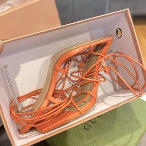 Orange strapping heels.